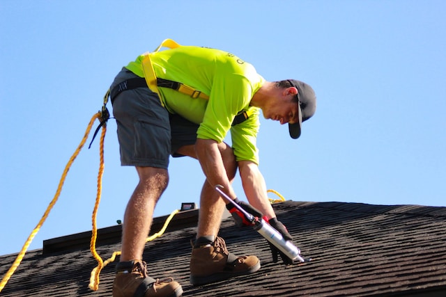 Repair man fixing roof